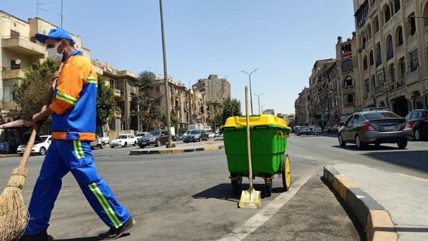 عمال النظافة في شوارع القاهرة